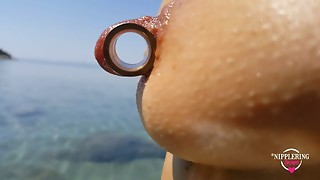 nippleringlover - ultra-kinky milf pissing on the naked beach, pierced pussy, broad open, huge pierced nipples