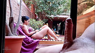My stepson takes out his big cock on the terrace, gets excited looking at me behind the window and showing his erection to the neighbors. My nipples are very hard and I'm not wearing a bra.